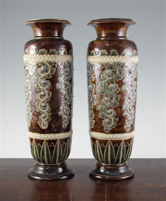George Tinworth for Doulton Lambeth. A pair of stoneware vases, c.1871, height 32cm (12.5in.), one rim damaged